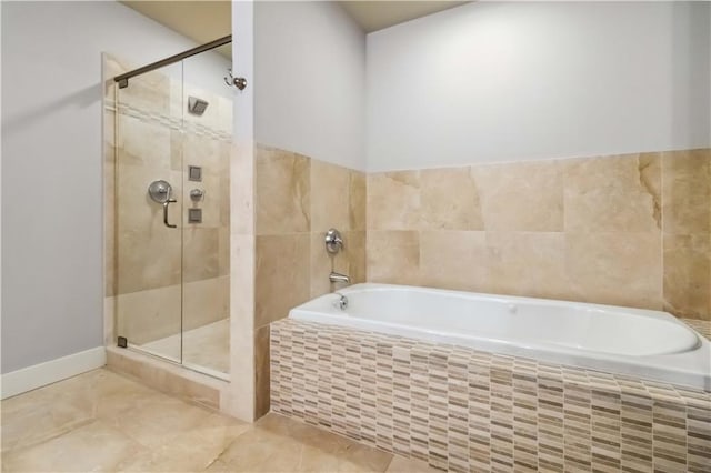 20 10th St NW Unit 704, Atlanta, GA 30309 - full bath with a garden tub, a stall shower, and tile patterned floors