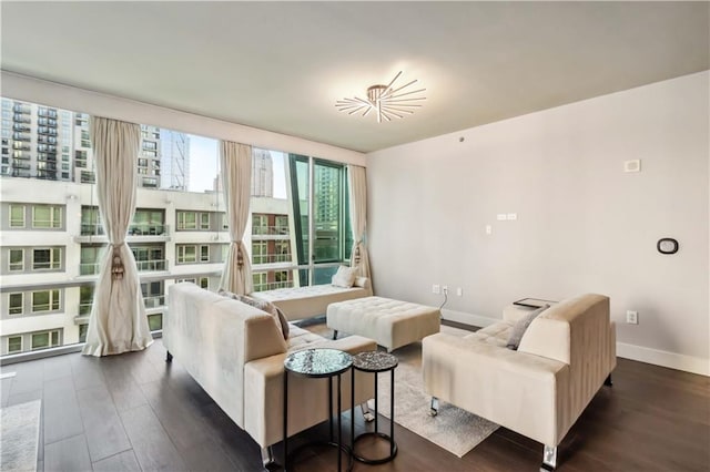 20 10th St NW Unit 704, Atlanta, GA 30309 - living room featuring baseboards and dark wood finished floors