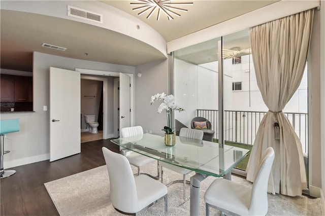 20 10th St NW Unit 704, Atlanta, GA 30309 - dining space with baseboards and wood finished floors