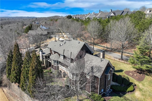 birds eye view of property with a residential view