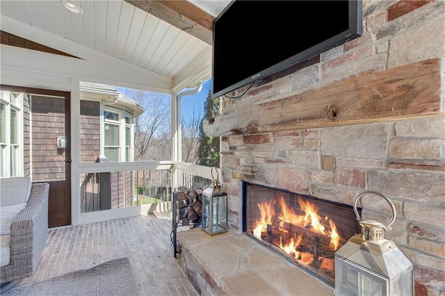 view of patio featuring an outdoor stone fireplace