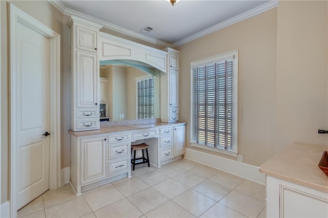 bathroom with visible vents, baseboards, tile patterned floors, crown molding, and vanity