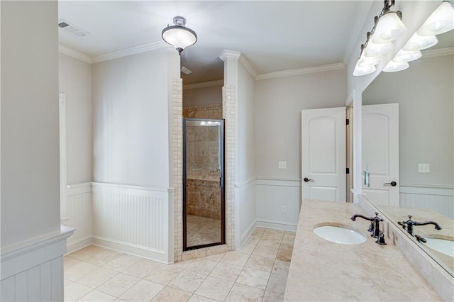 full bathroom with a wainscoted wall, visible vents, a shower stall, tile patterned floors, and crown molding