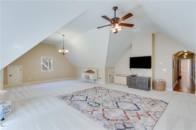 bonus room featuring lofted ceiling, carpet, visible vents, and arched walkways