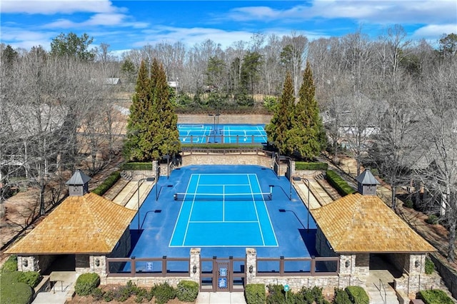 view of sport court with fence