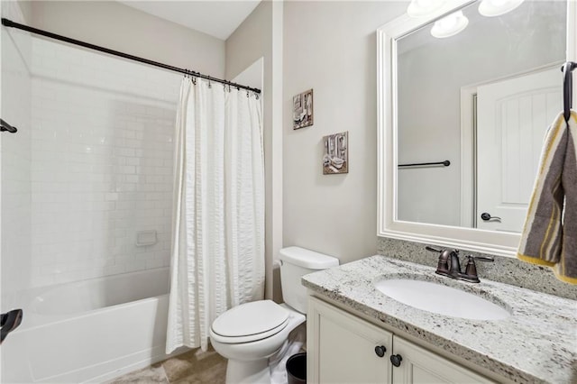 bathroom with toilet, shower / tub combo with curtain, and vanity