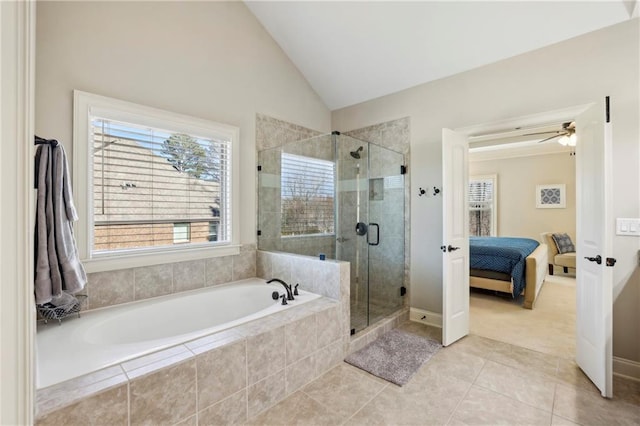 ensuite bathroom featuring ensuite bathroom, tile patterned flooring, vaulted ceiling, a bath, and a stall shower