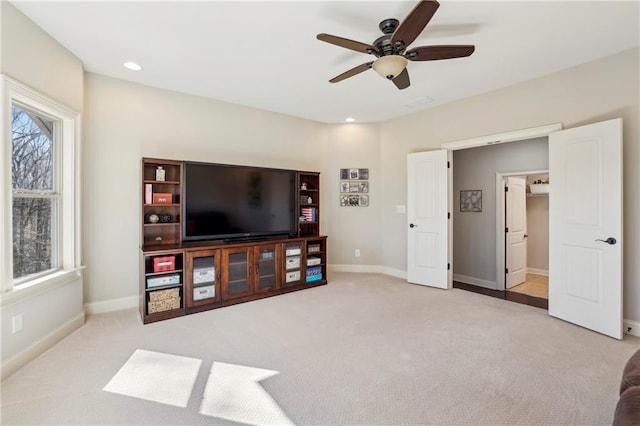 living room featuring light carpet, recessed lighting, a ceiling fan, and baseboards