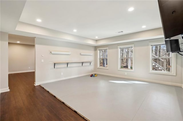 workout room with recessed lighting, dark wood finished floors, and baseboards