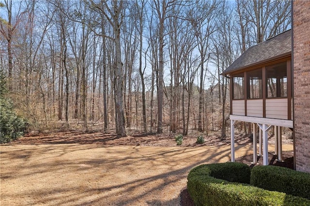 view of yard featuring a sunroom