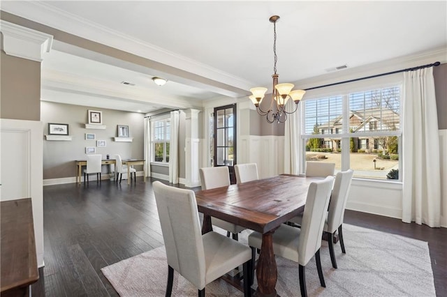 dining room with ornamental molding, a healthy amount of sunlight, visible vents, and decorative columns