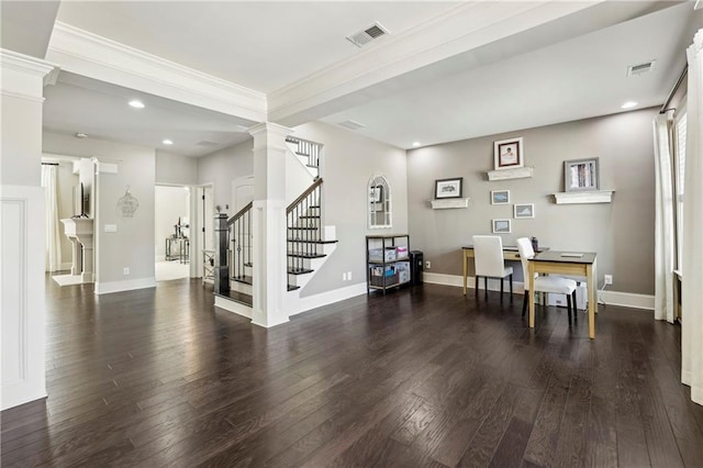 dining space featuring dark wood-type flooring, decorative columns, and visible vents