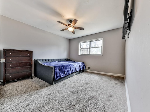 bedroom with carpet flooring, ceiling fan, visible vents, and baseboards