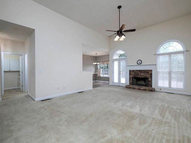 5 Glenn Eagles Vw, Hiram, GA 30141 - unfurnished living room with carpet floors, ceiling fan, plenty of natural light, a fireplace, and a high ceiling