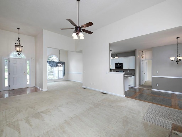 5 Glenn Eagles Vw, Hiram, GA 30141 - unfurnished living room featuring a chandelier, carpet floors, and a ceiling fan