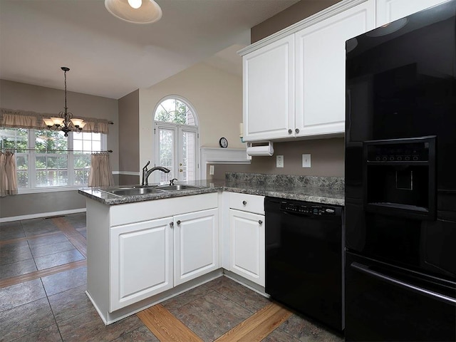 5 Glenn Eagles Vw, Hiram, GA 30141 - kitchen with black appliances, a peninsula, lofted ceiling, a chandelier, and white cabinetry