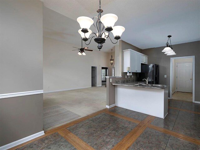 5 Glenn Eagles Vw, Hiram, GA 30141 - kitchen featuring freestanding refrigerator, a chandelier, a peninsula, white cabinetry, and ceiling fan
