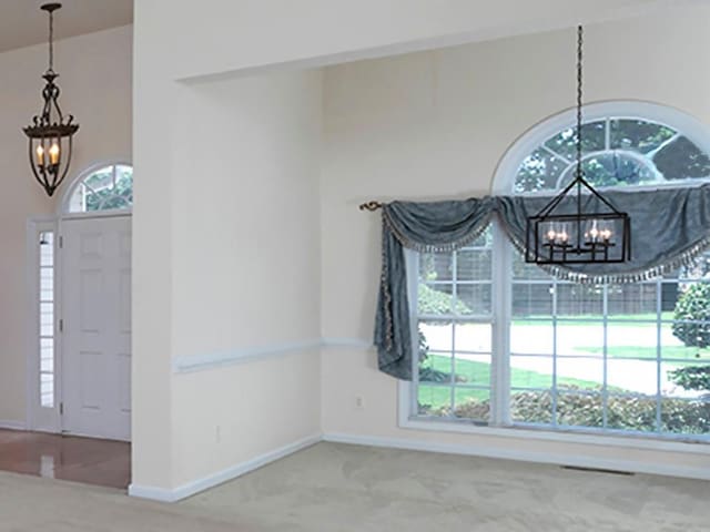 5 Glenn Eagles Vw, Hiram, GA 30141 - carpeted foyer entrance with a chandelier and baseboards