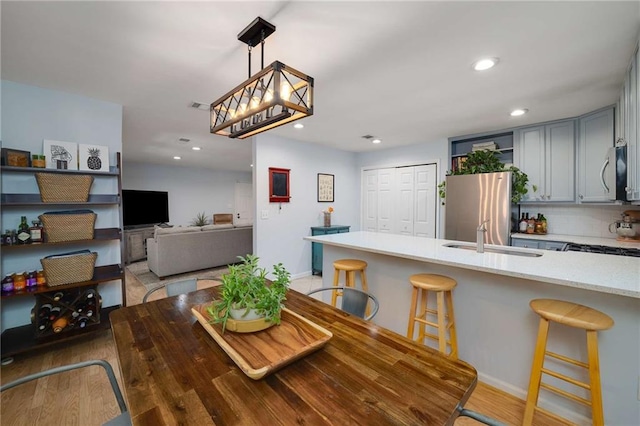 1445 Monroe Dr NE Unit C13, Atlanta, GA 30324 - dining room with recessed lighting, baseboards, and light wood-type flooring