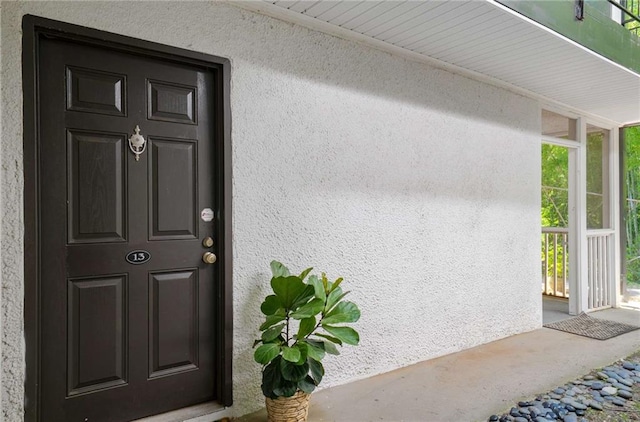 1445 Monroe Dr NE Unit C13, Atlanta, GA 30324 - view of exterior entry with stucco siding