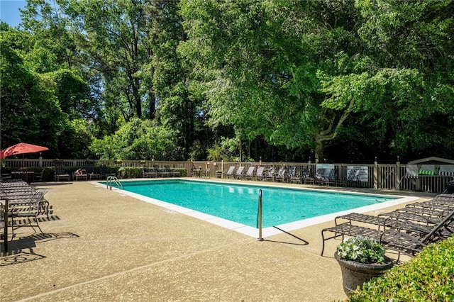 1445 Monroe Dr NE Unit C13, Atlanta, GA 30324 - community pool with a patio area and view of scattered trees