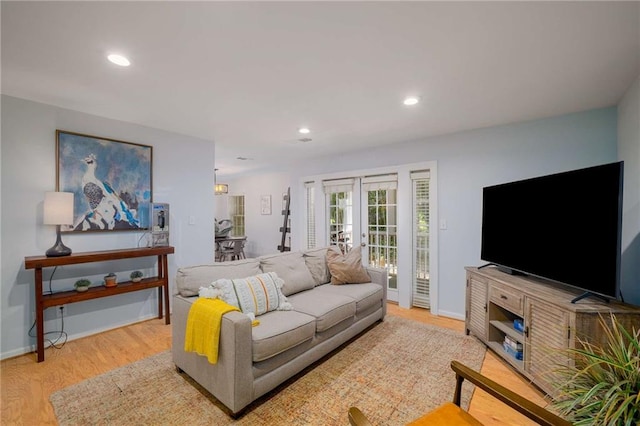 1445 Monroe Dr NE Unit C13, Atlanta, GA 30324 - living room featuring french doors, wood finished floors, recessed lighting, and baseboards