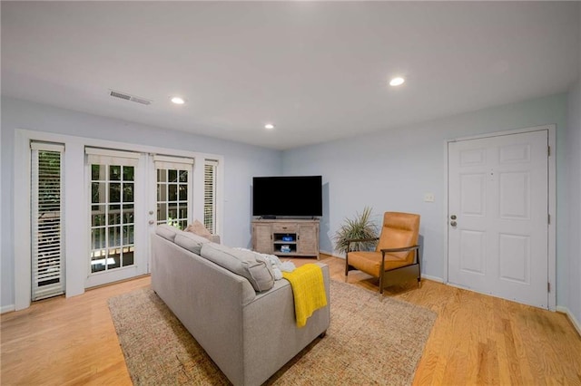 1445 Monroe Dr NE Unit C13, Atlanta, GA 30324 - living area featuring french doors, light wood-type flooring, recessed lighting, and baseboards