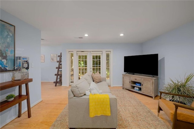 1445 Monroe Dr NE Unit C13, Atlanta, GA 30324 - living room with french doors, light wood-type flooring, recessed lighting, and baseboards