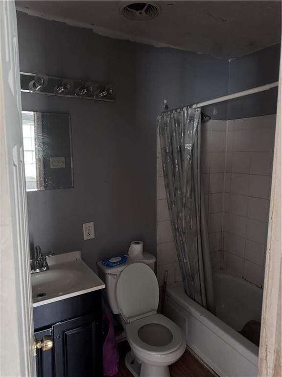 full bathroom with vanity, toilet, and shower / tub combo