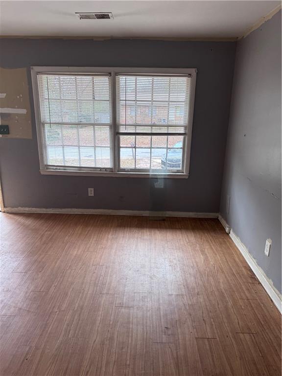 spare room with hardwood / wood-style flooring