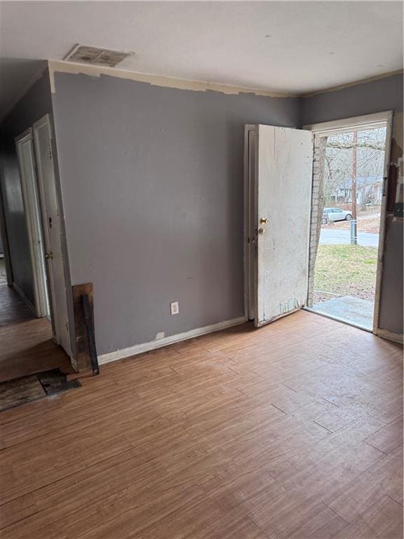 unfurnished living room featuring light hardwood / wood-style floors