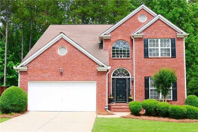 318 Ivy Manor Dr NW, Marietta, GA 30064 - view of front of home with concrete driveway, brick siding, a garage, and a front yard