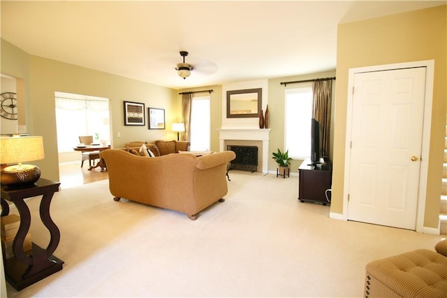 318 Ivy Manor Dr NW, Marietta, GA 30064 - living area with healthy amount of natural light, a fireplace with flush hearth, light colored carpet, and baseboards
