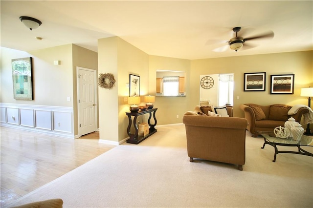 318 Ivy Manor Dr NW, Marietta, GA 30064 - living area with ceiling fan, light colored carpet, light wood finished floors, and baseboards