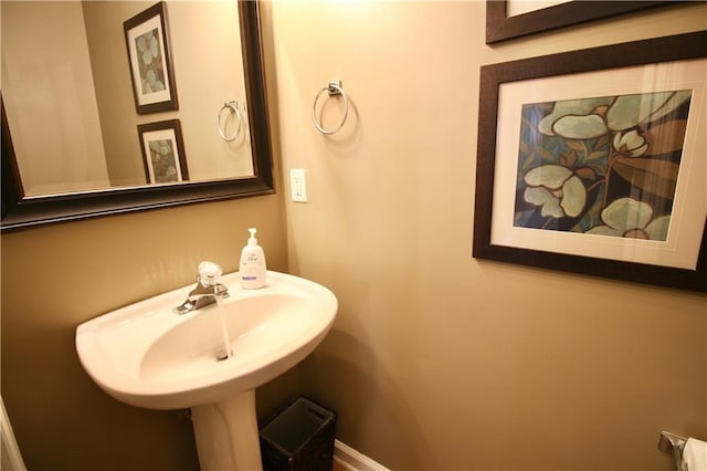 318 Ivy Manor Dr NW, Marietta, GA 30064 - bathroom featuring baseboards and a sink