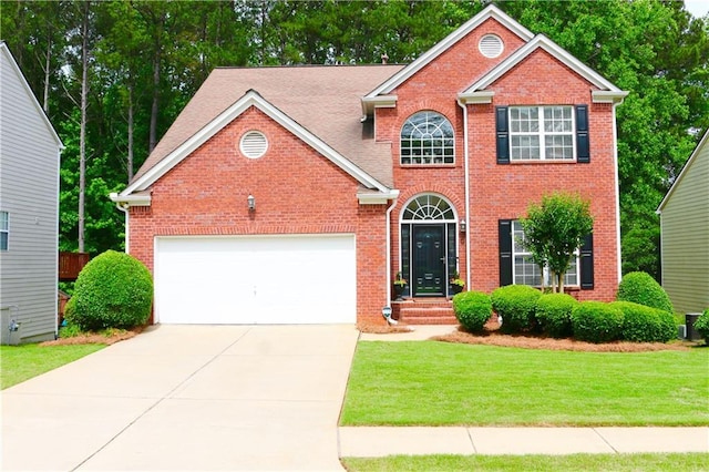 318 Ivy Manor Dr NW, Marietta, GA 30064 - view of front of property with brick siding, driveway, a front lawn, and an attached garage