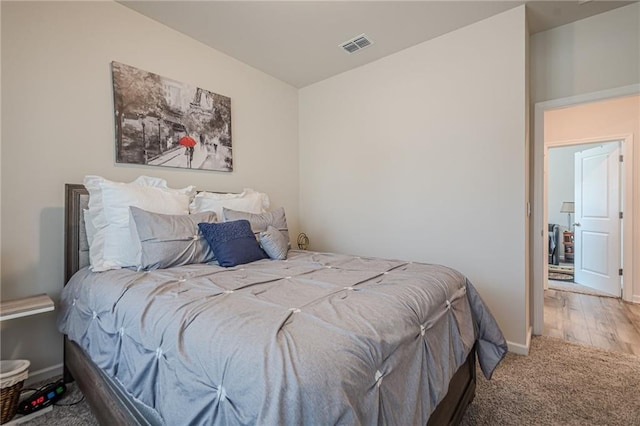 carpeted bedroom featuring baseboards
