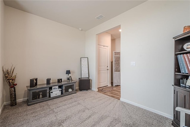 carpeted spare room with baseboards
