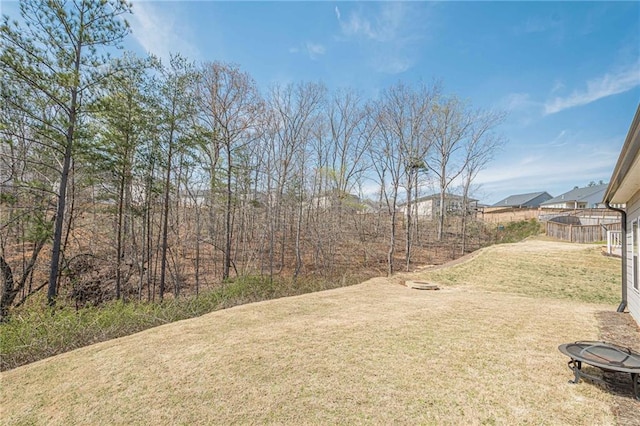 view of yard with an outdoor fire pit