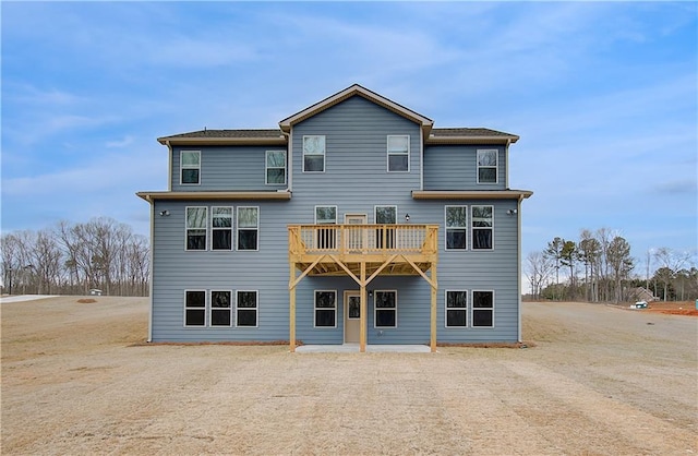 back of house with a balcony and a patio area