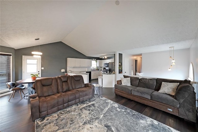 living area with dark wood-style floors and lofted ceiling