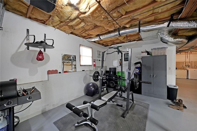 exercise room featuring separate washer and dryer