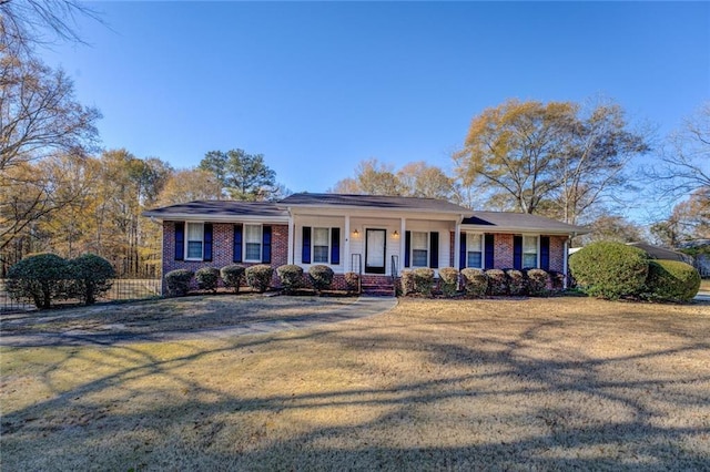 single story home with a front yard and a porch