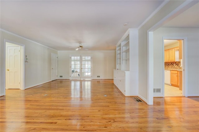 unfurnished living room with ceiling fan, ornamental molding, and light wood-type flooring