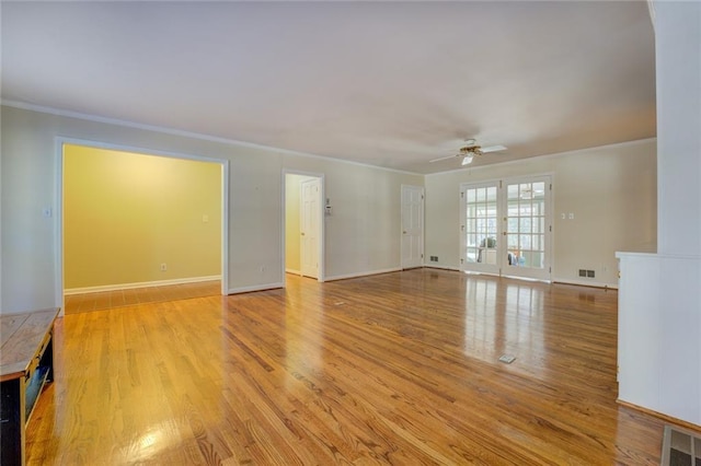 unfurnished living room featuring ceiling fan, light hardwood / wood-style floors, crown molding, and french doors