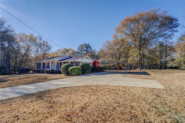 exterior space featuring covered porch and a carport