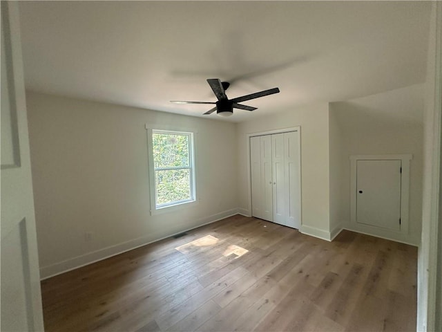 55 Noah Mountain Rd, Dahlonega, GA 30533 - unfurnished bedroom with baseboards, wood finished floors, and a closet