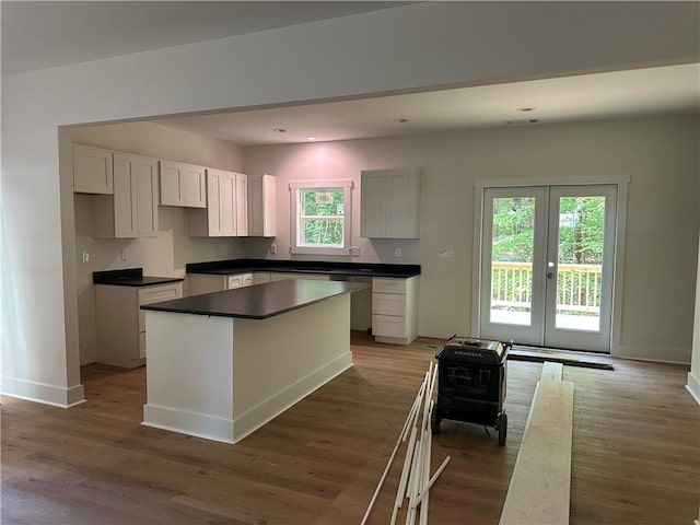 55 Noah Mountain Rd, Dahlonega, GA 30533 - kitchen with french doors, light wood-style floors, baseboards, a center island, and recessed lighting