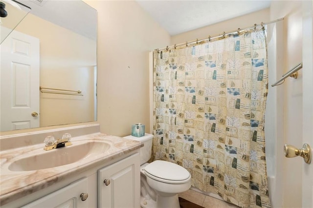 bathroom featuring tile patterned flooring, walk in shower, vanity, and toilet