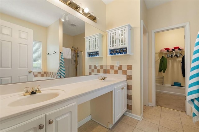 bathroom featuring tile patterned floors, vanity, and a shower with curtain